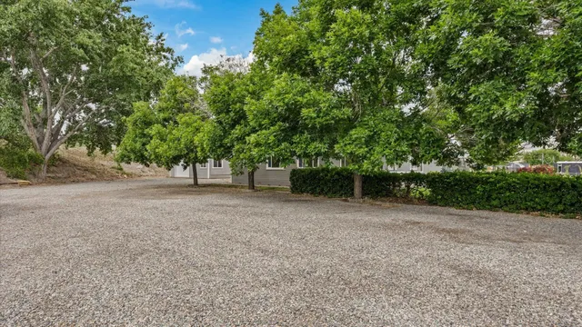 a view of a house with a yard and garage