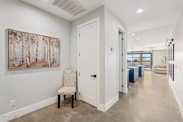 a living room with furniture and white walls