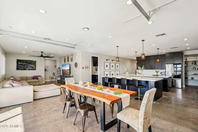 a living room with furniture a couch and a chandelier