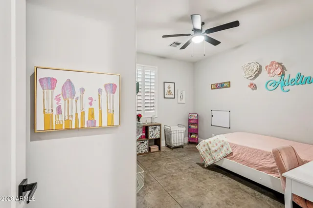 a white toilet sitting next to a white wall