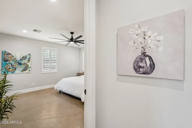 a living room with furniture and a dining table with kitchen view