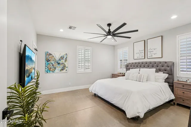 a view of a patio with a dining table and chairs with wooden floor