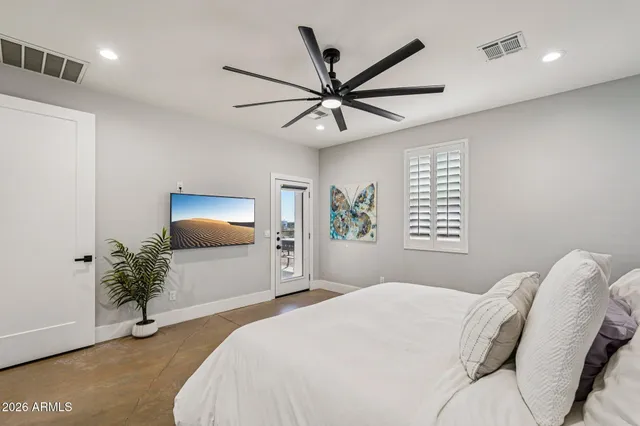a view of a house with snow on the road