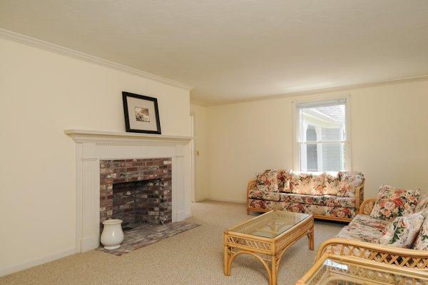 19 Nons Road Harwich Port, MA 02646 - Photo 7 of 12 a living room with furniture and a fireplace