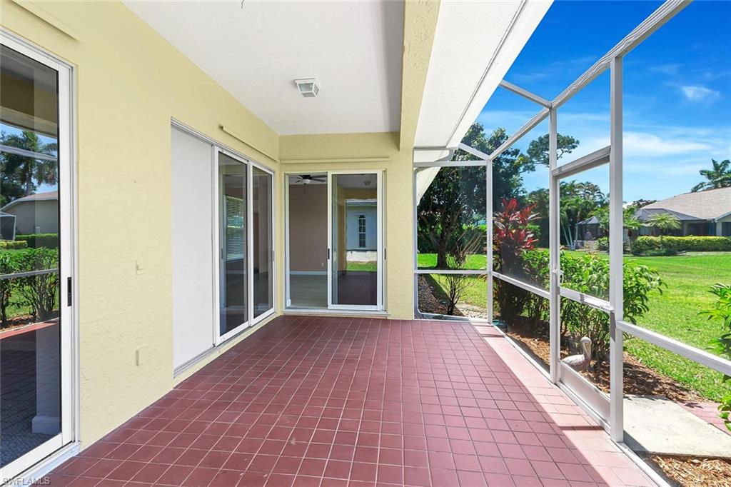 2389 Piccadilly Circus Naples, FL 34112 - Photo 13 of 21 a front view of a house with porch