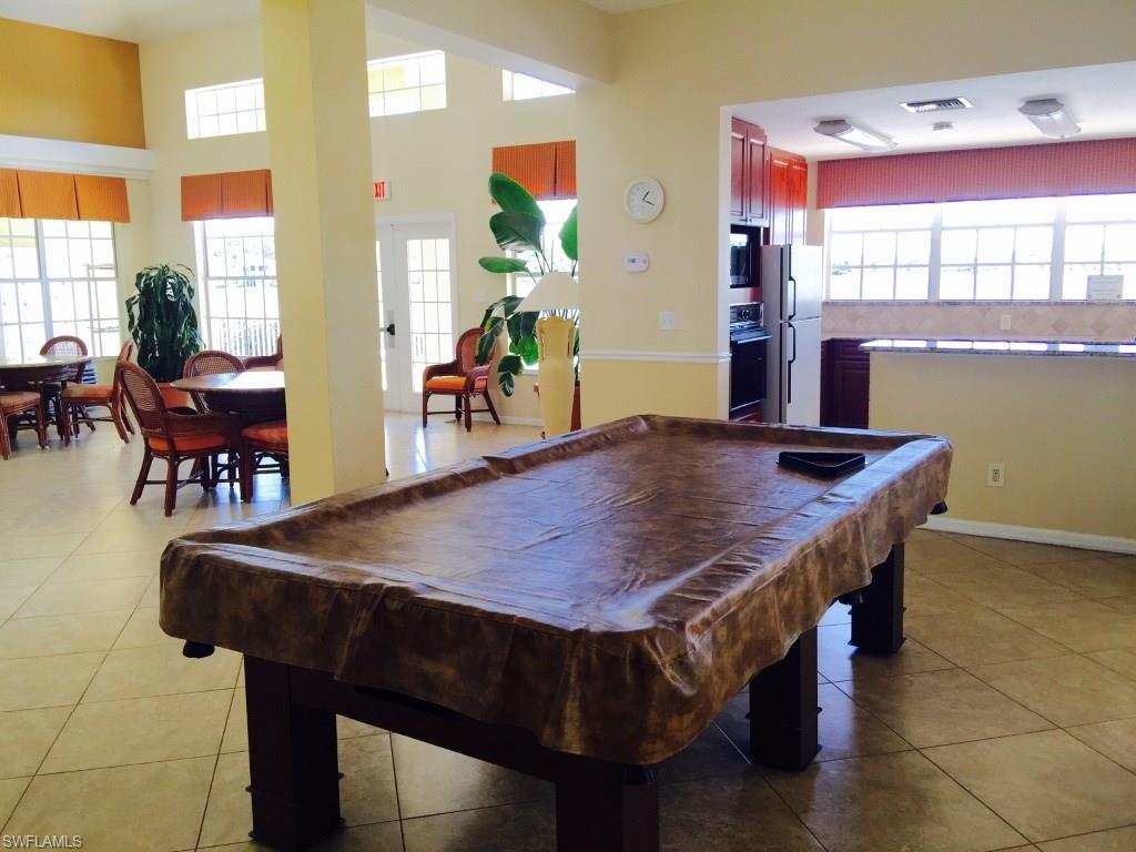 2389 Piccadilly Circus Naples, FL 34112 - Photo 18 of 21 a dining table with chairs and window