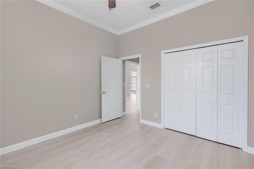 2389 Piccadilly Circus Naples, FL 34112 - Photo 7 of 21 an empty room with closet area