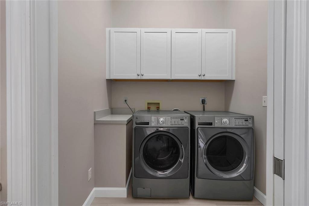 2389 Piccadilly Circus Naples, FL 34112 - Photo 8 of 21 a utility room with dryer and washer