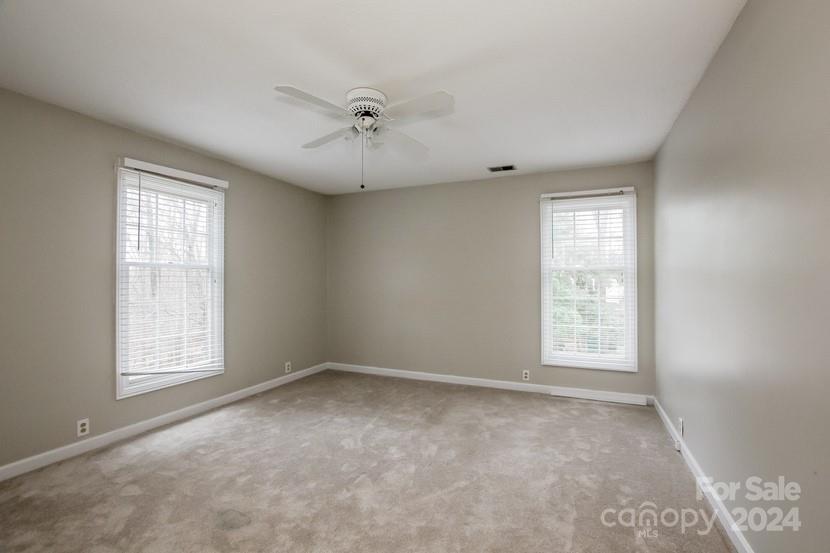9325 Raintree Lane Charlotte, NC 28277 - Photo 11 of 15 an empty room with windows and closet