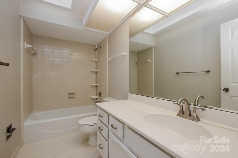 9325 Raintree Lane Charlotte, NC 28277 - Photo 14 of 15 a bathroom with a granite countertop sink a toilet and shower