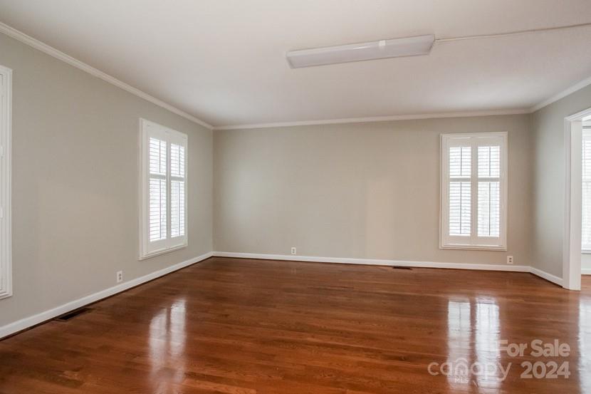 9325 Raintree Lane Charlotte, NC 28277 - Photo 2 of 15 wooden floor in an empty room with a window