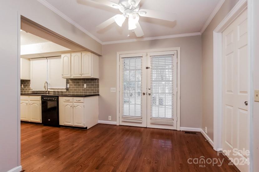 9325 Raintree Lane Charlotte, NC 28277 - Photo 4 of 15 a kitchen with a refrigerator and a stove top oven
