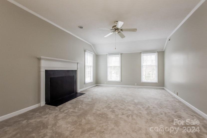 9325 Raintree Lane Charlotte, NC 28277 - Photo 10 of 15 a view of empty room with a fireplace