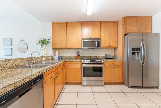 a bedroom with a large bed and a large window