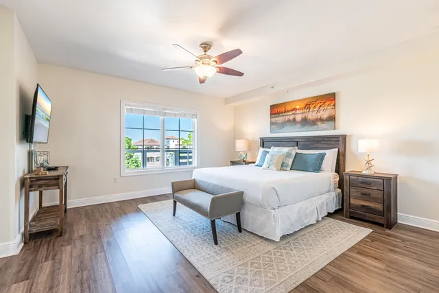 a bedroom with furniture and a chandelier