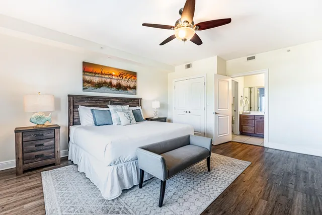 a spacious bathroom with a double vanity sink a large mirror a shower and a bathtub