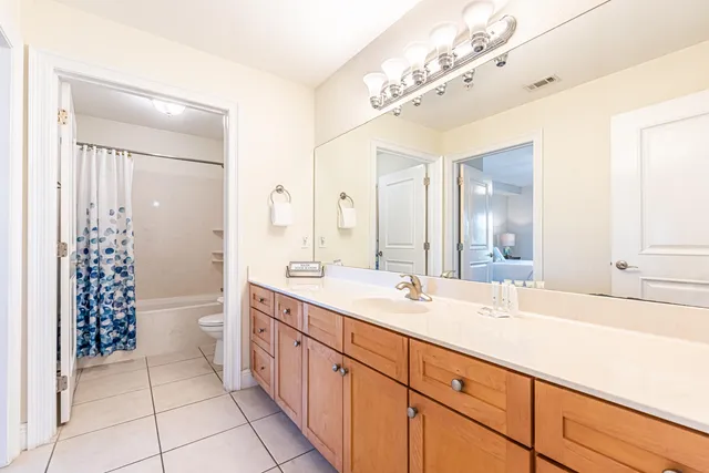 a bathroom with a toilet and a bathtub