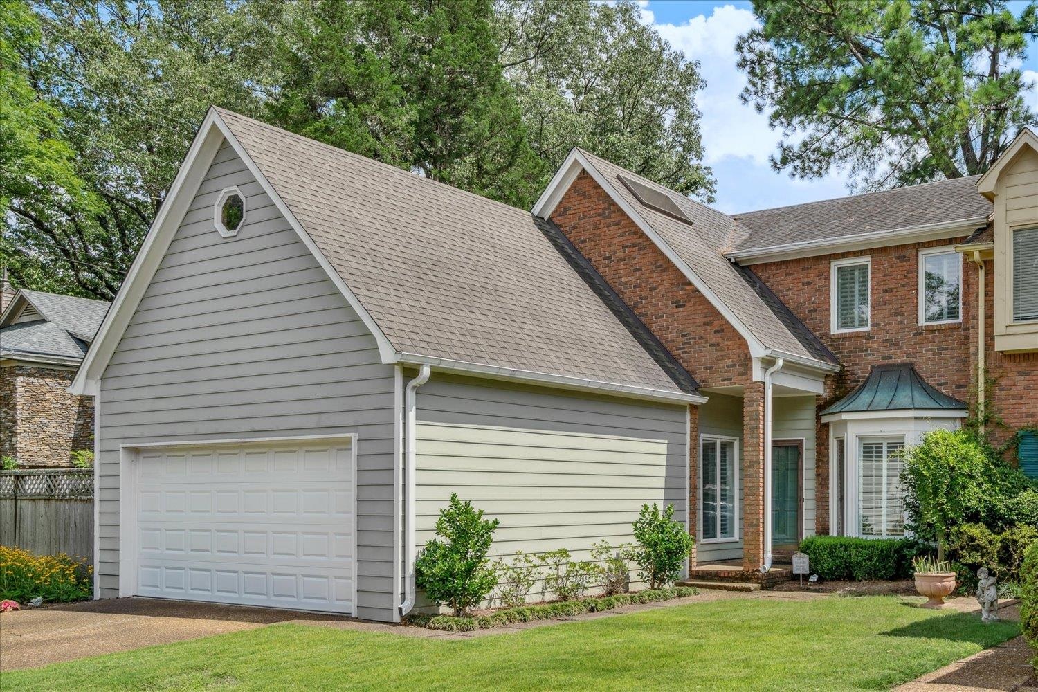 4821 Kingsgate Place South Memphis, TN 38117 - Photo 15 of 19 View of front facade featuring brick siding, driveway, and a shingled roof