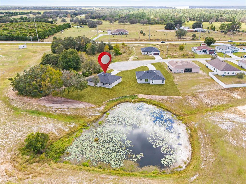 925 Desmoines Way Poinciana, FL 34759 - Photo 11 of 40 a view of a swimming pool with a yard