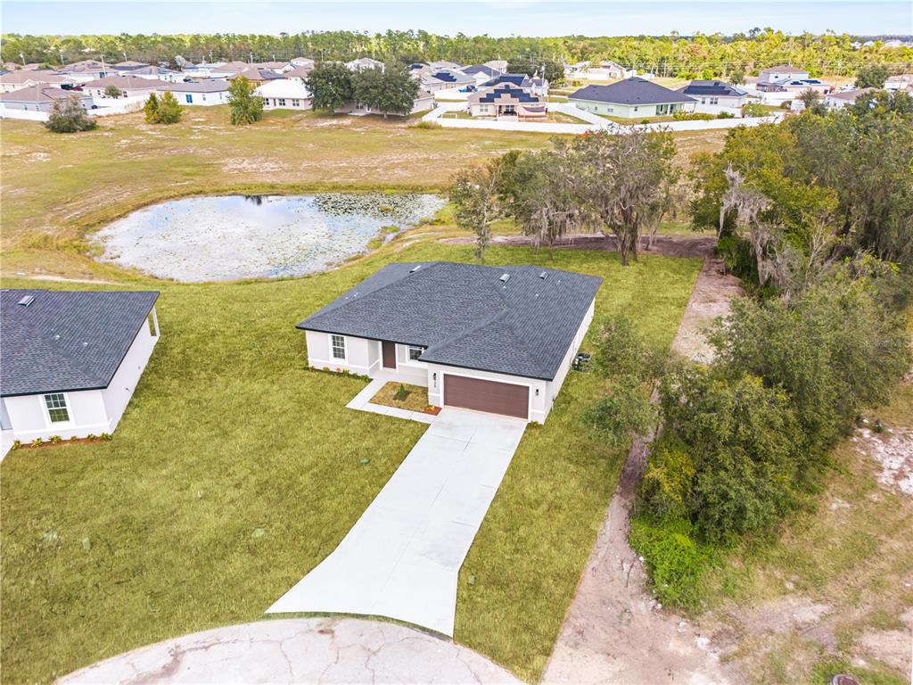 925 Desmoines Way Poinciana, FL 34759 - Photo 2 of 40 an aerial view of residential houses with outdoor space