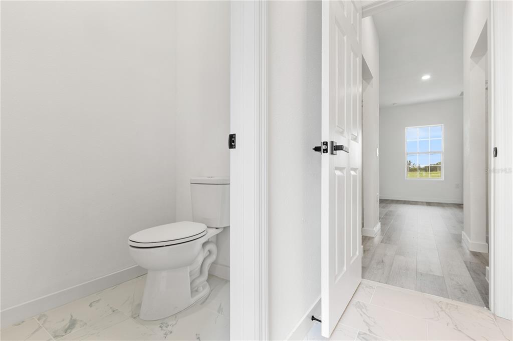 925 Desmoines Way Poinciana, FL 34759 - Photo 26 of 40 a bathroom with a toilet and a shower