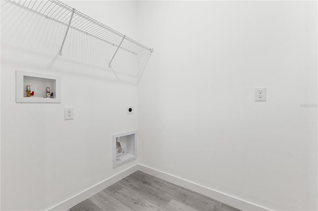 925 Desmoines Way Poinciana, FL 34759 - Photo 29 of 40 a view of a room with racks on the wall