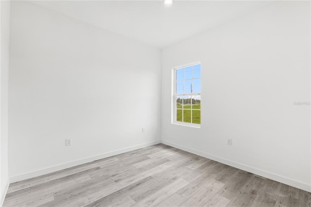 925 Desmoines Way Poinciana, FL 34759 - Photo 32 of 40 an empty room with a window