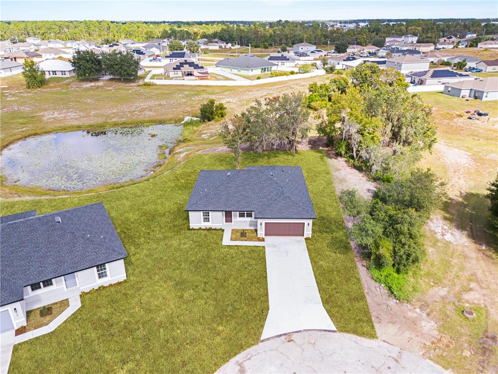 925 Desmoines Way Poinciana, FL 34759 - Photo 5 of 40 an aerial view of ocean residential houses with outdoor space