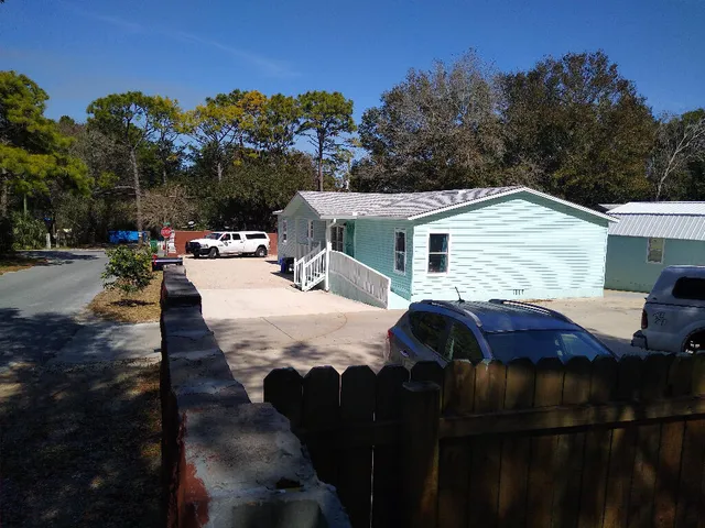 a view of a yard and front view of a house
