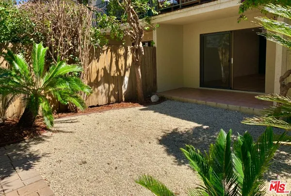 a view of a backyard of a house