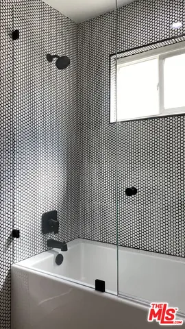 a bathroom with a sink and a shower