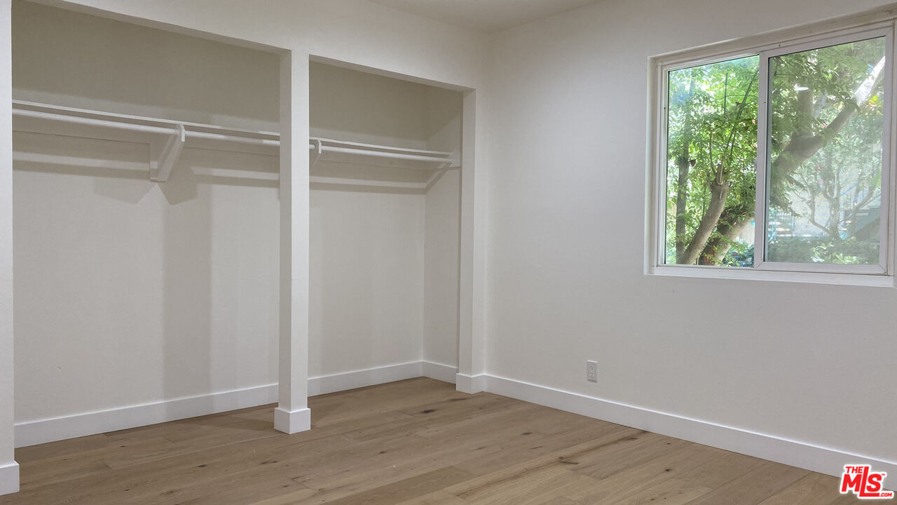 6474 Cavalleri Road Malibu, CA 90265 - Photo 19 of 24 a view of an empty room with wooden floor and window