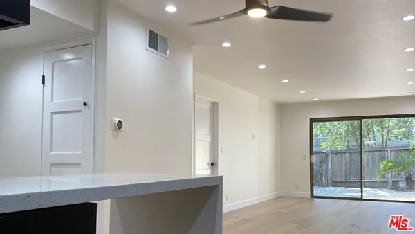 a view of a hallway with a window