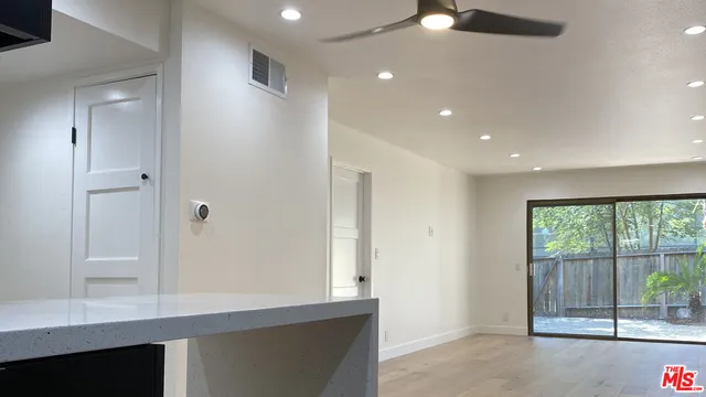 a view of a hallway with a window
