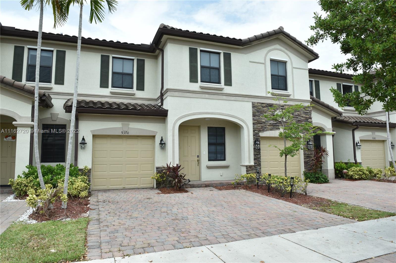 Hialeah Hialeah, FL 33018 - Photo 1 of 60 a front view of a house with a yard and garage