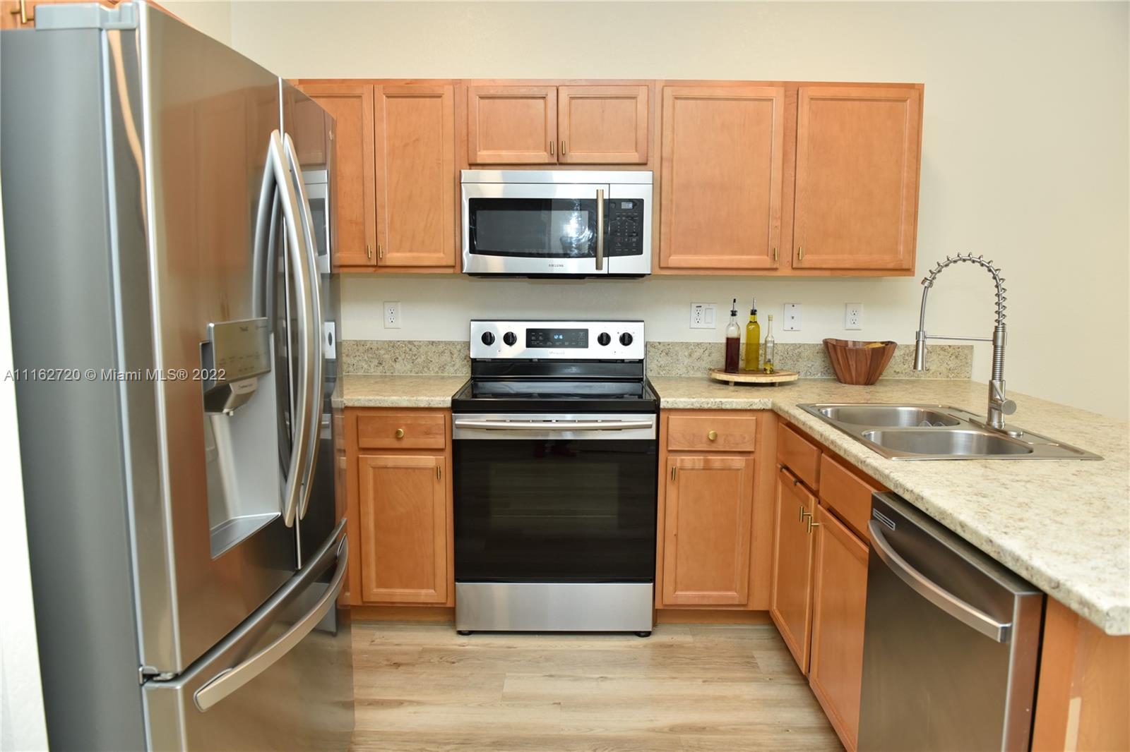 Hialeah Hialeah, FL 33018 - Photo 15 of 60 a kitchen with a sink stove and refrigerator
