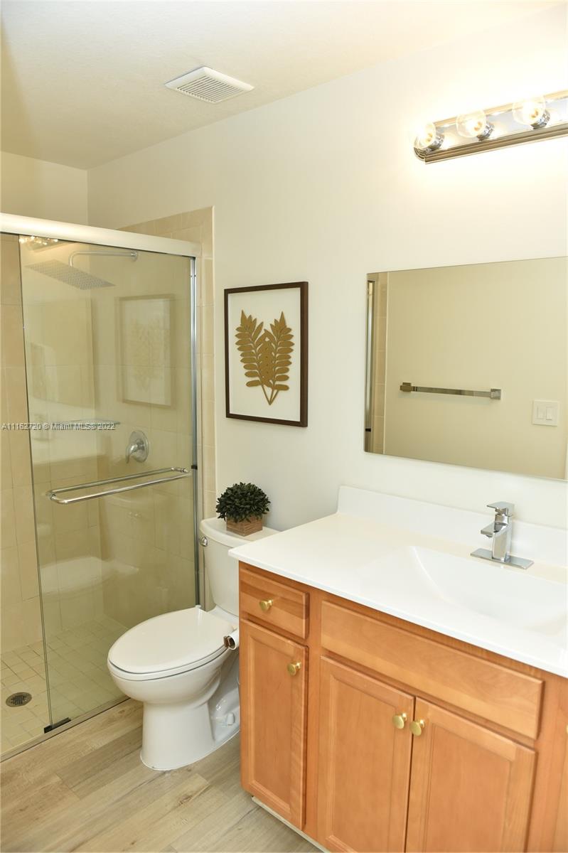 Hialeah Hialeah, FL 33018 - Photo 18 of 60 a bathroom with a sink a toilet and shower