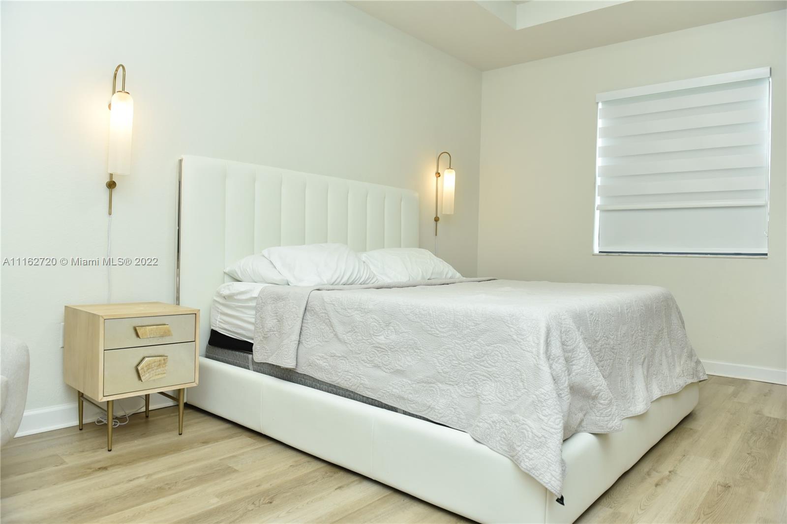 Hialeah Hialeah, FL 33018 - Photo 24 of 60 a bedroom with a bed and a window