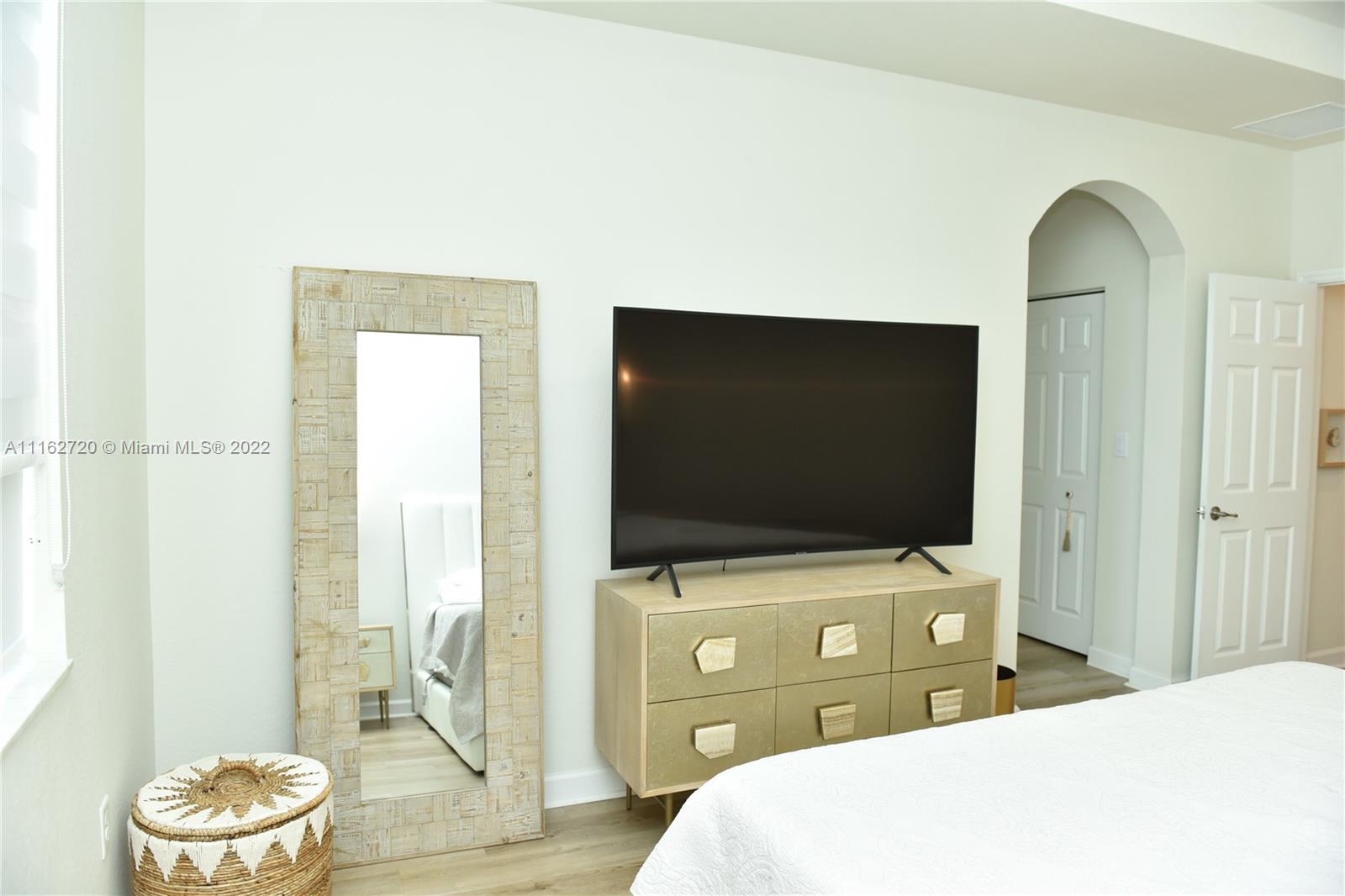Hialeah Hialeah, FL 33018 - Photo 26 of 60 a bedroom with a bed and a flat screen tv