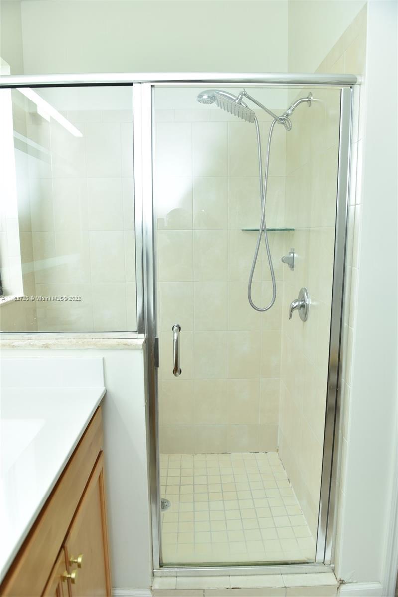 Hialeah Hialeah, FL 33018 - Photo 29 of 60 a bathroom with a glass shower door