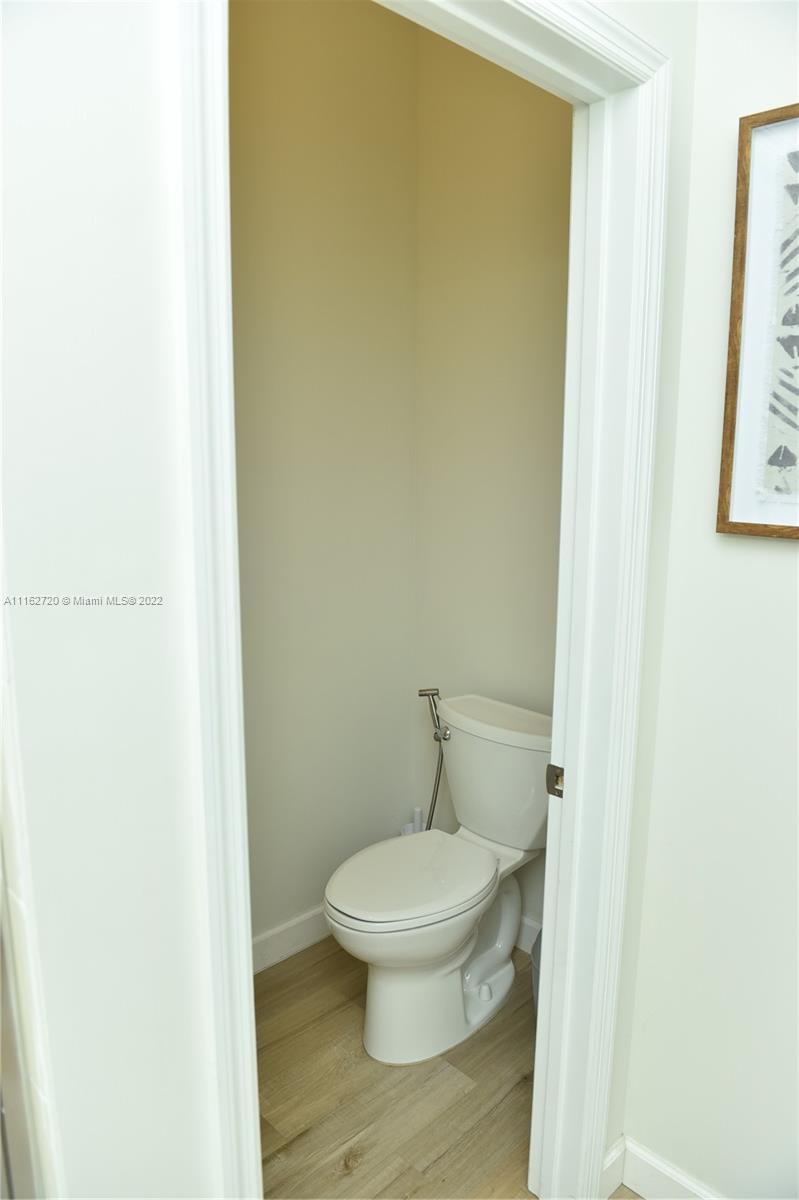 Hialeah Hialeah, FL 33018 - Photo 30 of 60 a white toilet sitting next to a white wall