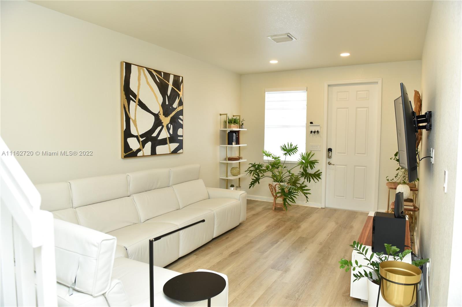 Hialeah Hialeah, FL 33018 - Photo 3 of 60 a living room with furniture and a potted plant