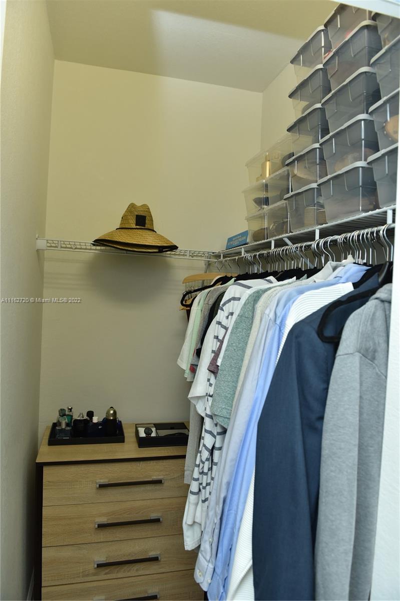 Hialeah Hialeah, FL 33018 - Photo 33 of 60 a view of walk in closet with clothes and shoes