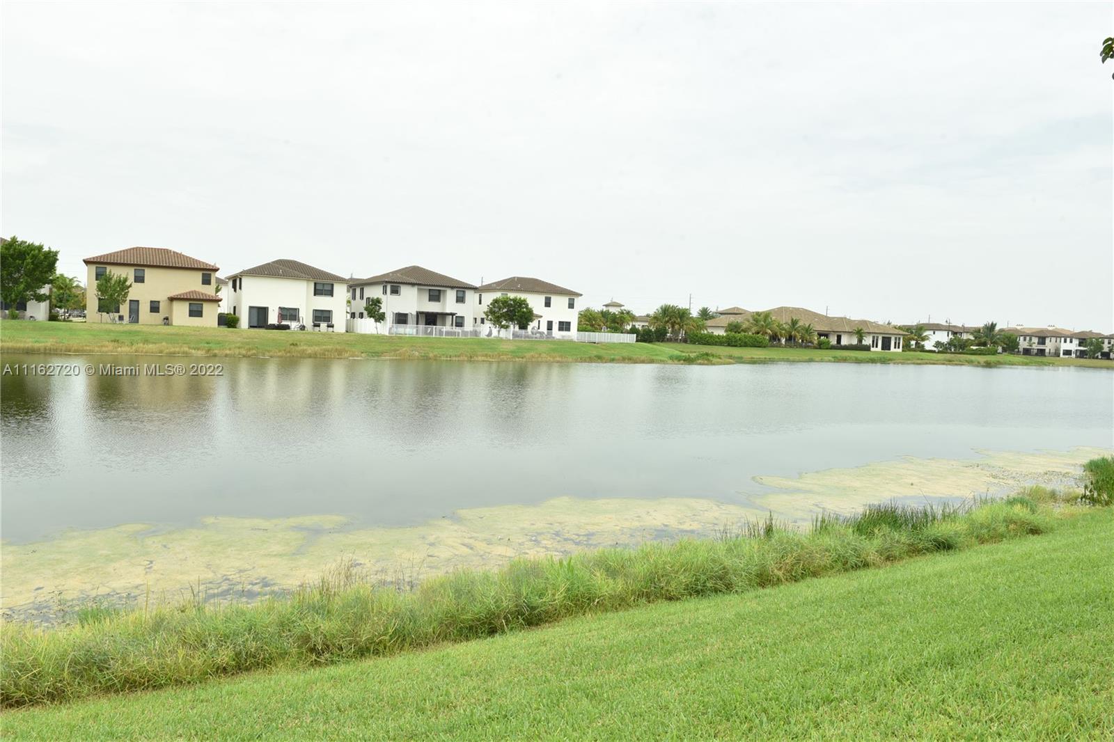 Hialeah Hialeah, FL 33018 - Photo 47 of 60 a view of a lake with houses in the back