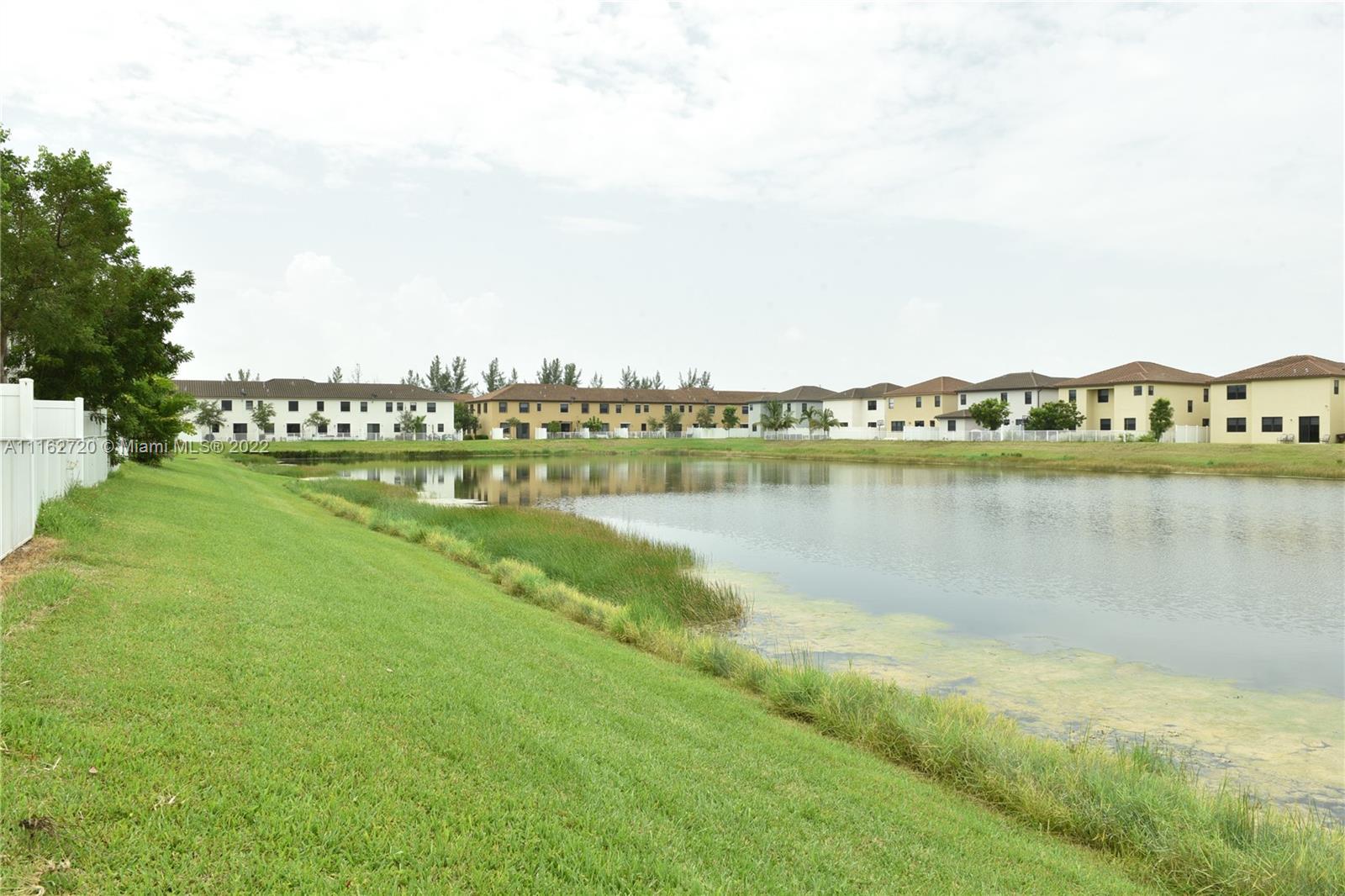 Hialeah Hialeah, FL 33018 - Photo 48 of 60 a view of a lake with houses in the back