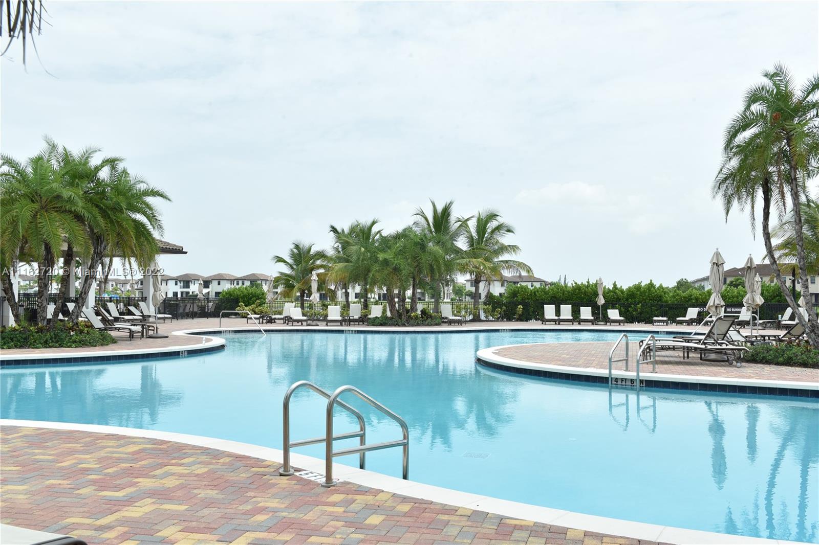 Hialeah Hialeah, FL 33018 - Photo 56 of 60 a view of a lake with a table and chairs