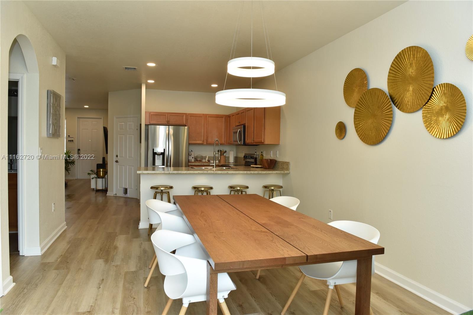 Hialeah Hialeah, FL 33018 - Photo 9 of 60 a kitchen with a table and chairs