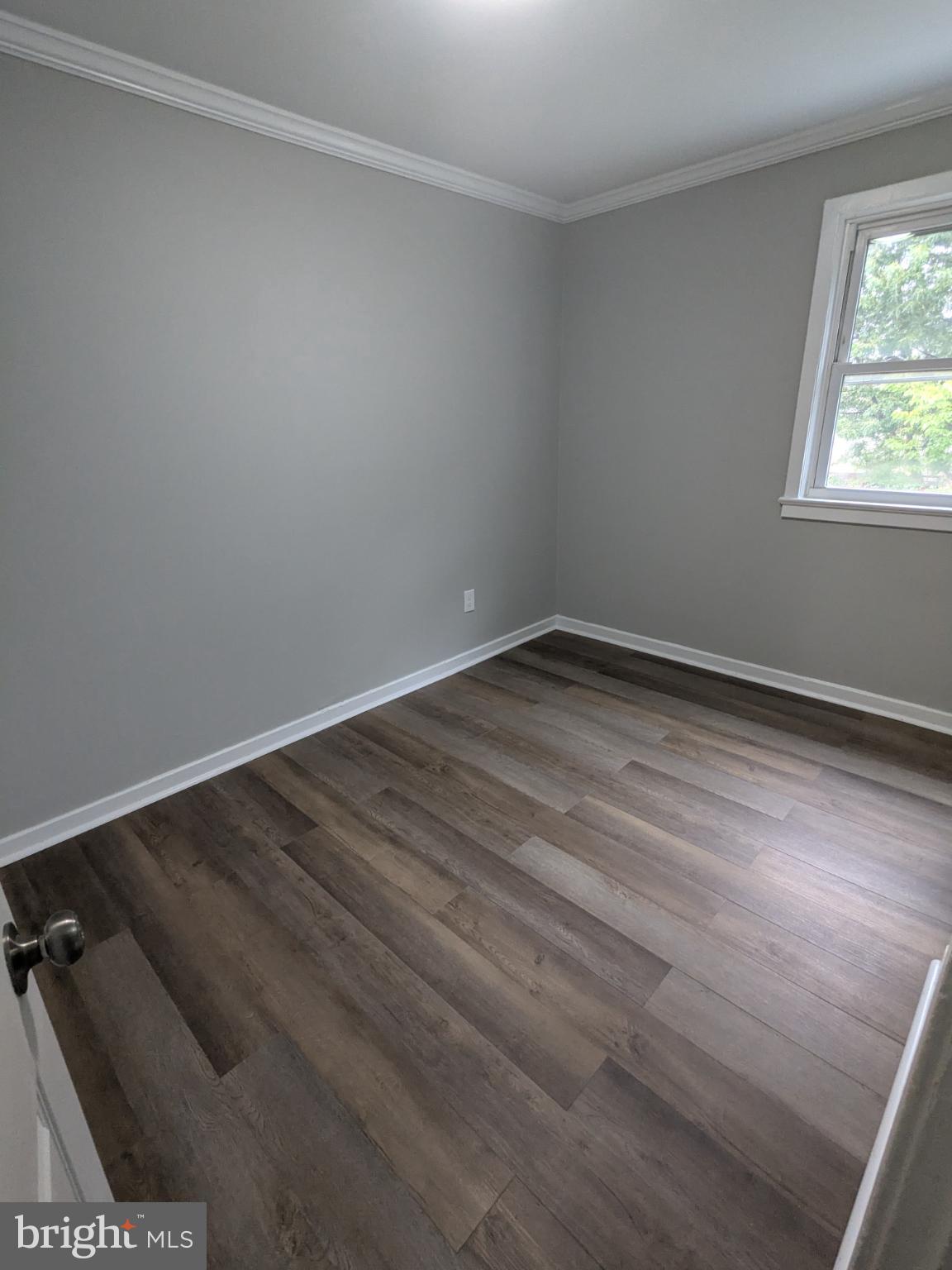 2834 Iverson Street, Unit 101 Temple Hills, MD 20748 - Photo 11 of 13 wooden floor in an empty room
