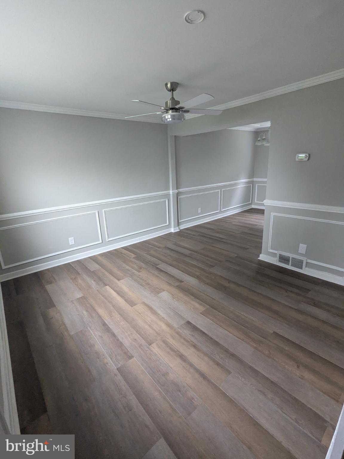 2834 Iverson Street, Unit 101 Temple Hills, MD 20748 - Photo 3 of 13 a room with a flat screen tv