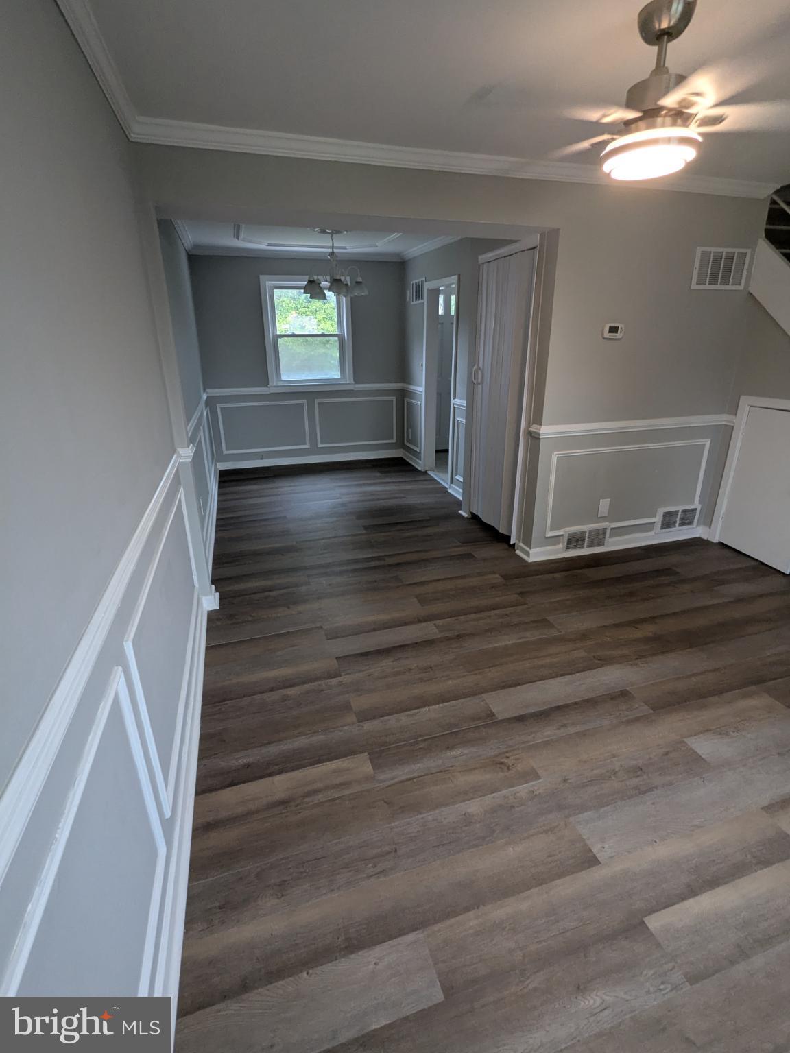 2834 Iverson Street, Unit 101 Temple Hills, MD 20748 - Photo 10 of 13 a view of wooden floor and staircase in a room